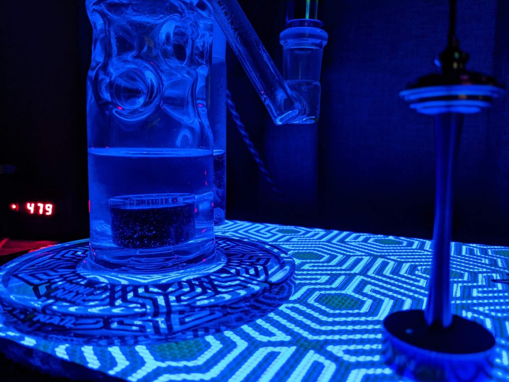 The MiniNail kit lit in blue by the Slabpad