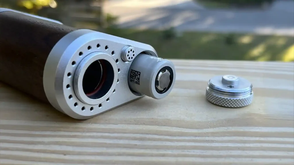 Tinymight 2 with its battery door removed and 18650 battery half inserted