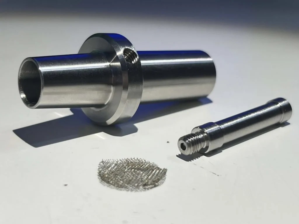 Tinymight 2 glass water pipe adapter disassembled into its three parts: adapter, handle, and screen.
